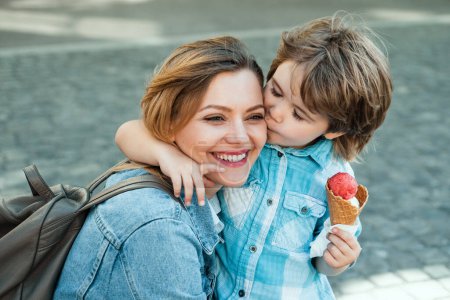 Photo for Mother and child eat icecream outdoor. Junk food. Delicious summer ice cream - Royalty Free Image