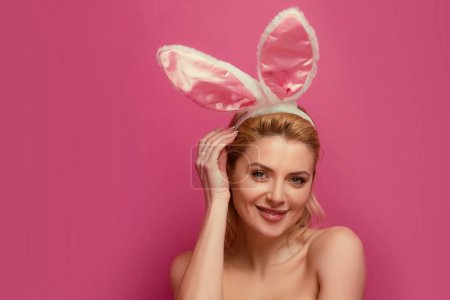 Photo for Young woman with bunny ears. Rabbit girl celebrating easter - Royalty Free Image