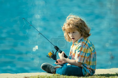 Photo for Happy child fishing on the lake. Boy with spinner at river. Fishing concept - Royalty Free Image