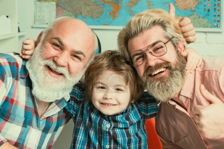 Photo for Portrait of cute son hugging Father and Grandfather. Delighted cute boy hugging his father and grangfather - Royalty Free Image