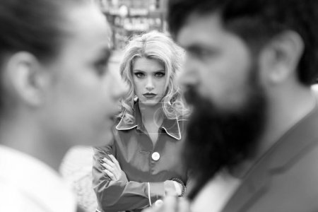 Photo for Really jealous of him. Jealous woman look at couple in love on street. Romantic couple of man and woman dating. Bearded man cheating his girlfriend with another woman. Unhappy girl feeling jealous - Royalty Free Image