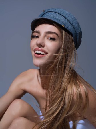Photo for Beautiful sensual young woman in fashion cap hat, close up studio portrait. Beautiful model, sexy girl face. Fashion and beauty - Royalty Free Image