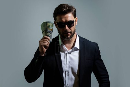 Photo for Man with dollars banknotes. Business man holding lots of 100 dollar bills. Easy money credit. Black cash. Payday and payment concept. Profit and richness. Earn money. Businessman successful deal - Royalty Free Image