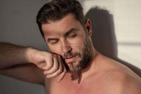 Beautiful man with clean perfect skin. Beauty male skin care. Cosmetology cosmetics beauty and spa. Male facial treatment and wellness. Male coscmetic and beauty concept. Face care, male cosmetics