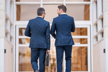 Photo for Two business men brainstormed ideas for their next business. Business men analyzed the market trends before making their decision. Business successful. Businessmen were motivated to succeed - Royalty Free Image