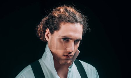 Photo for Handsome curly brunet. Young man tense face in white shirt. Barbershop advertising. Man with confident face and brutal style isolated on black background - Royalty Free Image