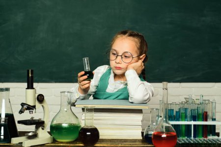 Photo for My chemistry experiment. Little kids scientist earning chemistry in school lab. Little children at school lesson. School concept - Royalty Free Image