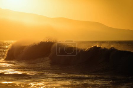 Photo for Gold sky and sea water. Sunrise in the sea with soft wave and cloudy. Golden sunrise sunset over the sea waves. Sunrise over the ocean - Royalty Free Image