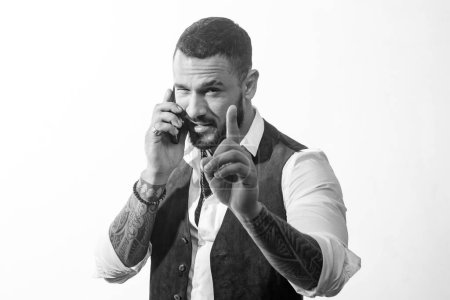 Foto de Handsome latin man speak on phone. macho man isolated on white. corporate discussion. Business people using devices. Business and entrepreneurship concept. Business manager has an active discussion. - Imagen libre de derechos