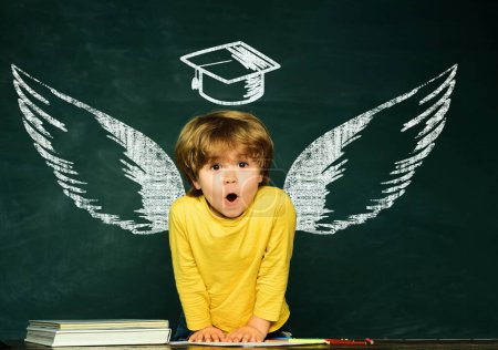 Photo for School wings and dream. Elementary school. Back to school and happy time. Blackboard background. Learning at home. Back to school - Royalty Free Image