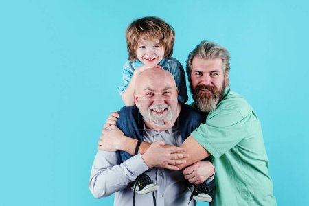 Photo for Happy man family concept laugh and have fun together. Three generations ages: grandfather father and child son together. Male Multi Generation Family, isolated - Royalty Free Image