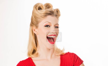 Photo for Face expressions. Looking camera, showing pointing, copyspace. Beautiful young american girl in retro style, pinup - Royalty Free Image