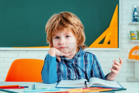 Photo for Elementary school. Individual teaching. Cute little preschool kid boy with teacher study in a classroom. Educational process - Royalty Free Image