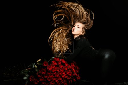 Photo for Sexy girl with big rose bouquet. Rich woman. Valentines day - Royalty Free Image