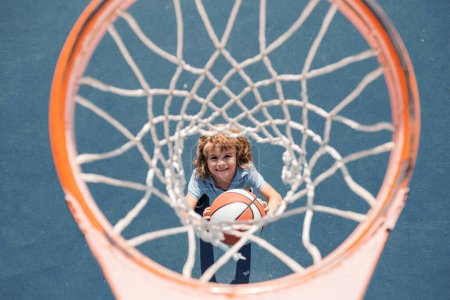 Photo for Child playing basketball. Healthy children lifestyle. Kids sport activity - Royalty Free Image
