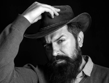 Foto de Moda retro masculina. Retrato de vaquero en sombrero de cuero. American Western. Rodeo del oeste salvaje - Imagen libre de derechos