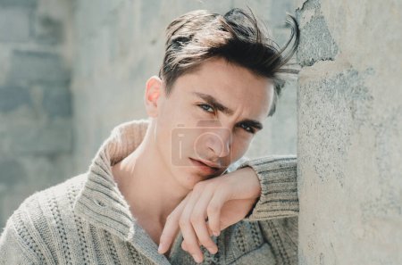 Photo for Portrait of satisfied young man against grey wall. Close up face of fashionable latin man on grey background - Royalty Free Image