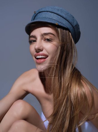 Photo for Sexy woman face. Sensual young woman posing with fashion cap hat. Beautiful sexy model. Beauty female face. Sensual girl, sexy model portrait. Natural beauty - Royalty Free Image