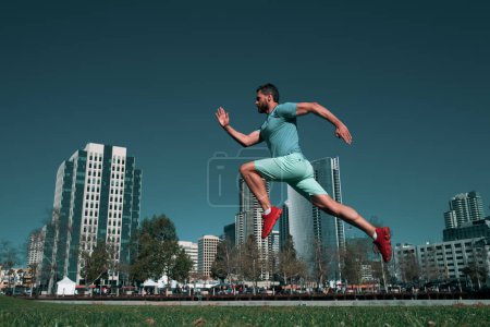 Photo for Sporty man runner running in San Diego city - Royalty Free Image