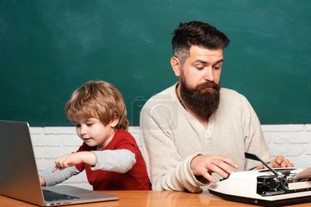 Photo for Teacher teaches a student to use a microscope. Education and learning people concept - little student boy and Teacher. Young boy doing his school homework with his father. Young adult concept - Royalty Free Image