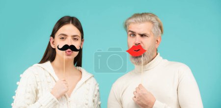 Photo for Gender discrimination and sexism. Male and female characters in gender symbols. Couple of woman with moustache and man with red lips. Transgender gender identity, equality and human rights - Royalty Free Image