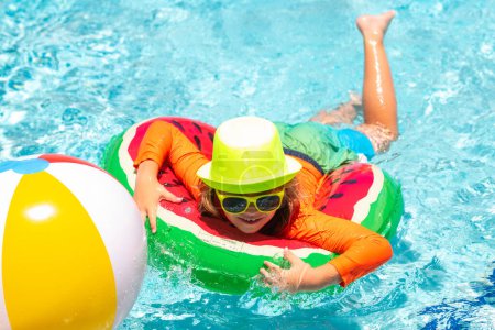 Photo for Child in swimming pool. Summer activity. Healthy kids lifestyle. Child swim in poolside in water background - Royalty Free Image