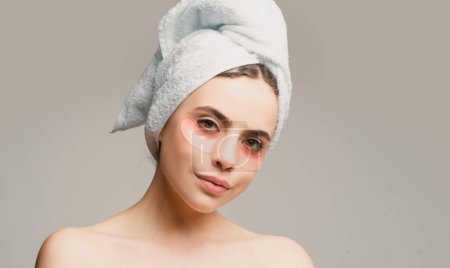 Photo for Portrait of beauty woman with eye patches showing an effect of perfect skin. Brunette spa girl. Eyes mask cosmetic patches woman face - Royalty Free Image