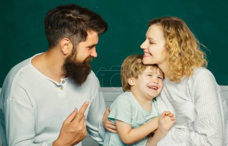 Photo for Parenting Education mathematics concept. School concept. Mathematics for kids. Kids gets ready for school. Happy young couple who are standing with their son at graduation. Family day - Royalty Free Image