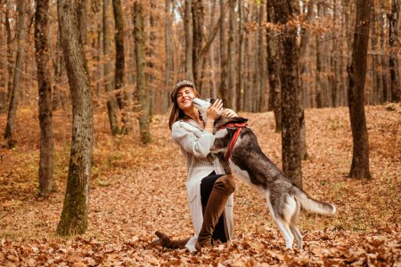 Unconditional love. Girl enjoy walk with husky dog. Siberian husky favorite pet. Animal husbandry. Girl pretty stylish woman walking with husky dog autumn forest. Pedigree dog concept. Best friends.
