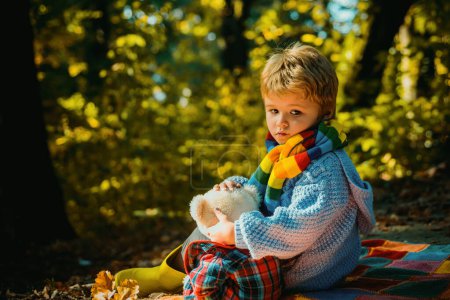 Photo for Picnic with teddy bear. Hiking with favorite toy. I will show you beauty of nature. Inseparable with toy. Boy cute child play with teddy bear forest background. Child took favorite toy to nature. - Royalty Free Image