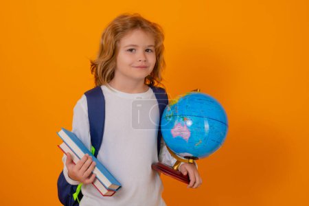Photo for School boy world globe and book. School kid 7-8 years old with book go back to school. Little student. Education concept - Royalty Free Image