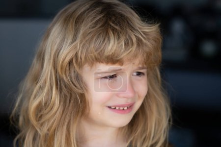 Téléchargez les photos : Portrait of crying kid with tears weeping emotion, hurt in pain. Tear drops on cheek - en image libre de droit