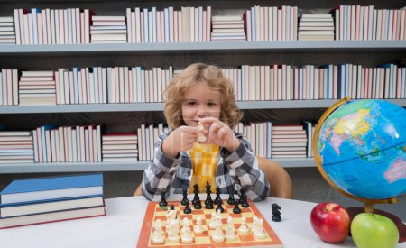 Photo for Little chess player. Kid playing chess. Clever child thinking about chess. Kids early development - Royalty Free Image