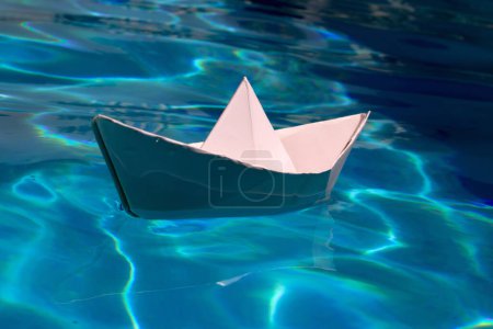 Photo for Paper ship sail. Paper boat on the sea water background. Dreaming traveling - Royalty Free Image