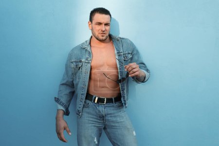 Photo for Jeanse man fashion. Bare torso. Nude male body. Handsome muscular guy. Abs - Royalty Free Image