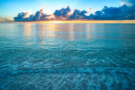 Sea sunset with sky and sun through the clouds over. Caribbean sea. Ocean and sky background, seascape.