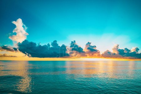 Photo for Pacific ocean. Sunset sea landscape. Colorful beach sunrise with calm waves. Nature sea sky. Nature landscape view of beautiful tropical beach. Sunrise with clouds of different colors against sky - Royalty Free Image