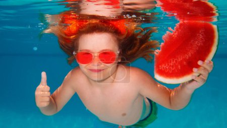 Photo for Funny kids boy with watermelon swim in the sea water. Child swimming underwater in swimming pool. Summer vacation with child - Royalty Free Image