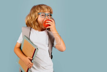 Photo for School little student hold books. Kids education concept. Child in school uniform - Royalty Free Image
