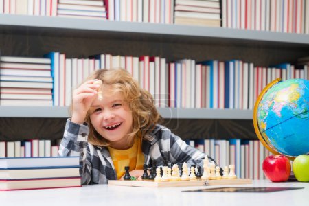 Photo for Chess, success and winning. Happy child playing chess. Child boy developing chess strategy, playing board game - Royalty Free Image