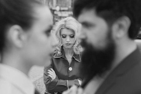 Photo for Divorce reason. Infidelity. Disloyal man walking with his girlfriend and looking amazed at another seductive girl. Obsessed ex girlfriend spying to a couple dating - Royalty Free Image