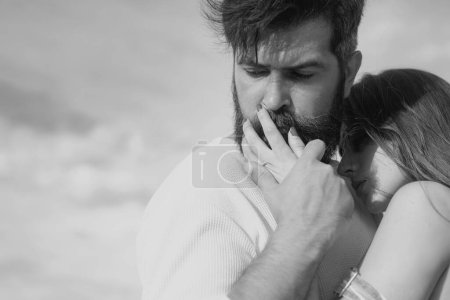 Photo for Passionate man gently kissing beautiful woman with desire. Retro couple. Happy couple in love having fun. Feeling desire. Enjoying tender warm pleasant moment of love - Royalty Free Image