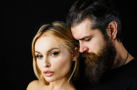 Photo for Fashion vogue stylish young couple looking at camera in studio on black. Hipsters love. Rock style - Royalty Free Image