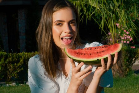 Photo for Sexy girl eating a watermelon. Outdoor portrait of beautiful young woman model. Summer sexy watermelon - Royalty Free Image