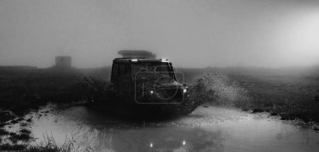 Photo for Mud and water splash in off-road racing. Off road car. Beautiful nature. Truck car wheel on offroad steppe adventure trail - Royalty Free Image