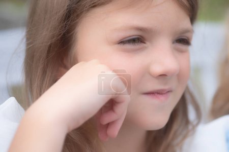 Photo for Kids dreaming face. Portrait of kid outdoors. Close-up face child playing outdoors in summer park. Portrait of cute thoughtful child girl. Dreaming people - Royalty Free Image