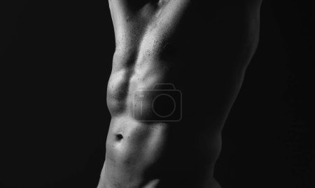 Foto de Nude man torso. Sexy torso. Male flexing his muscles. Sport workout bodybuilding concep. Cropped body of sexy muscular naked gay. Bare abs guy - Imagen libre de derechos
