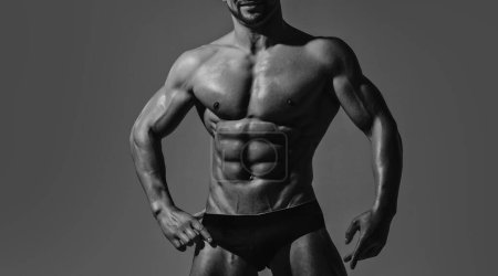 Foto de Hombre sexy con cuerpo musculoso y torso desnudo. Hombre musculoso sin camisa, chico atractivo. Hombre atlético, modelo de fitness - Imagen libre de derechos