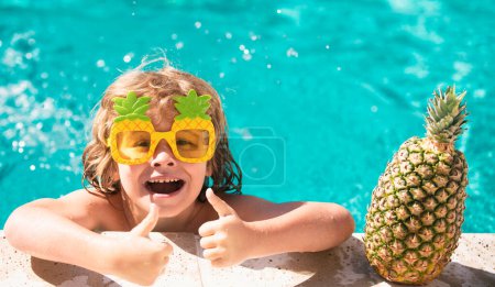 Photo for Summer vacation fun. Cute kid in swimming pool. Summer pineapple fruit. Funny amazed face - Royalty Free Image