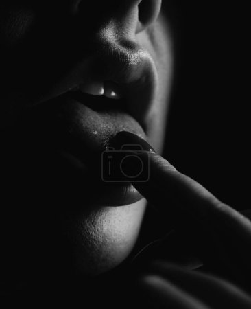 Photo for Lips lick finger, close up. Sexy woman lips. Macro woman mouth licking fingers. Glamour art lips concept - Royalty Free Image